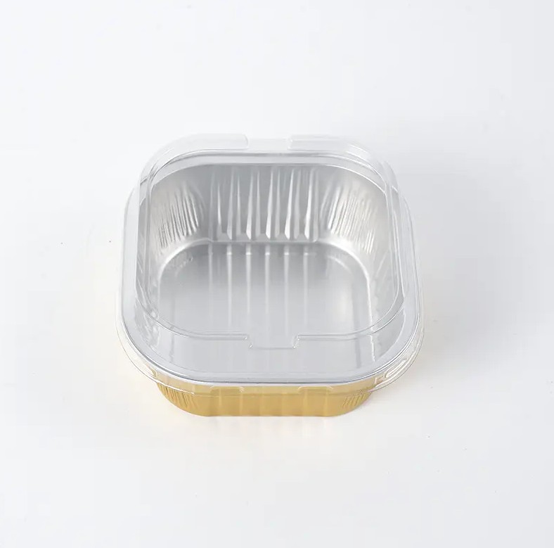 Bagaimana desain anti kerut dari Wadah Makanan Aluminium Foil Persegi Bebas Kerut diwujudkan selama proses produksi, dan apa dampaknya terhadap penggunaan wadah tersebut?